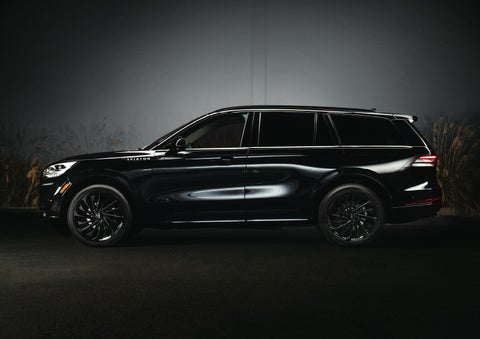 A 2024 Lincoln Aviator® SUV is shown in the Infinite Black exterior color | Lincoln Demo 2 in Wooster OH