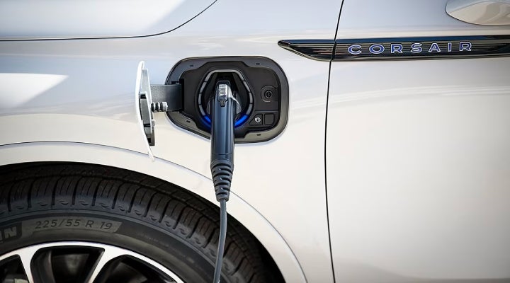 An electric charger is shown plugged into the charging port of a Lincoln Corsair® Grand Touring
model. | Lincoln Demo 2 in Wooster OH