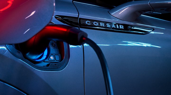 A charger plugged into the charging port of a 2024 Lincoln Corsair® Plug-in Hybrid model. | Lincoln Demo 2 in Wooster OH