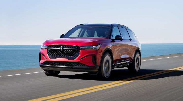 A 2025 Lincoln Nautilus® SUV is being driven on a seaside roadway. | Lincoln Demo 2 in Wooster OH