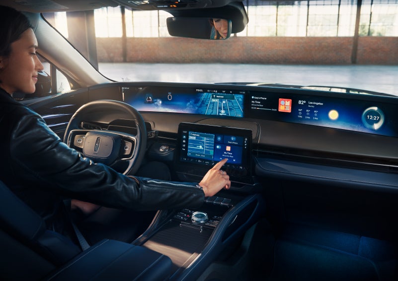 The driver of a 2025 Lincoln Nautilus® SUV interacts with the center touchscreen. | Lincoln Demo 2 in Wooster OH