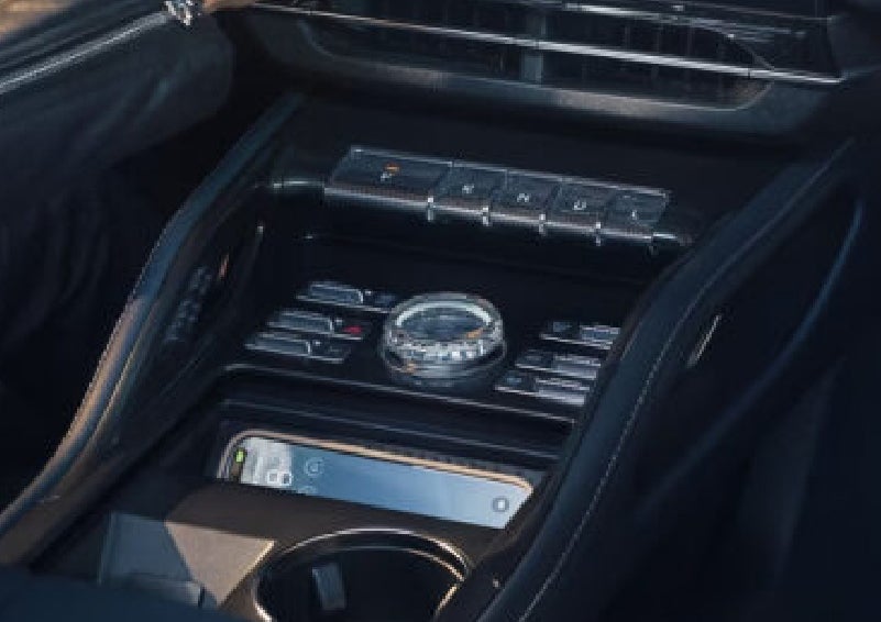 A smartphone is shown charging in the wireless charging pad. | Lincoln Demo 2 in Wooster OH